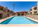 Beautiful swimming pool with clear blue water in a gated community with desert landscaping at 1401 E Puget Ave # 10, Phoenix, AZ 85020