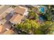 An aerial view showing the backyard including a pool and spa, with tile roof and a small deck at 15806 N 45Th Pl, Phoenix, AZ 85032