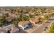 An aerial view shows the house among a large residential neighborhood and highlights landscaping and dual garage doors at 15806 N 45Th Pl, Phoenix, AZ 85032