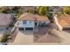 Aerial view of a two-story home with a tile roof, three-car garage, and desert landscaping at 15806 N 45Th Pl, Phoenix, AZ 85032