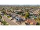 Aerial view highlights landscaping, dual garage doors, nearby homes and mountain views in the distance at 15806 N 45Th Pl, Phoenix, AZ 85032