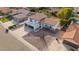 Aerial view of a two-story home featuring a tile roof, balcony, and desert landscaping at 15806 N 45Th Pl, Phoenix, AZ 85032