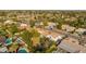 Aerial view shows property in relation to other homes nearby, including a pool and landscaped yard at 15806 N 45Th Pl, Phoenix, AZ 85032