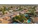 Aerial view of the property in a large residential neighborhood showing well-maintained landscaping and nearby pools at 15806 N 45Th Pl, Phoenix, AZ 85032