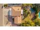 An aerial view focuses on the home's tile roof, well-maintained backyard and its proximity to neighboring properties at 15806 N 45Th Pl, Phoenix, AZ 85032