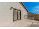 Exterior view of balcony with iron railing and French doors against a stucco wall at 15806 N 45Th Pl, Phoenix, AZ 85032