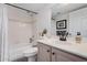 Bathroom featuring a shower-tub combo, and a vanity with modern fixtures at 15806 N 45Th Pl, Phoenix, AZ 85032