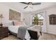 Inviting bedroom with a large window, cozy bedding, and stylish decor, perfect for relaxation at 15806 N 45Th Pl, Phoenix, AZ 85032