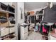 Walk-in closet providing ample storage with shelving and clothing racks at 15806 N 45Th Pl, Phoenix, AZ 85032