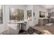Bright eat-in kitchen with a table for two and view into kitchen with stainless steel appliances at 15806 N 45Th Pl, Phoenix, AZ 85032