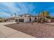 Beautiful property showcasing desert landscaping, a private balcony, and a spacious three-car garage at 15806 N 45Th Pl, Phoenix, AZ 85032