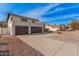 Inviting two-story home featuring a balcony, beautiful desert landscaping, and a spacious three-car garage at 15806 N 45Th Pl, Phoenix, AZ 85032