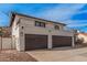 Spacious three-car garage of a two-story home featuring a private balcony at 15806 N 45Th Pl, Phoenix, AZ 85032