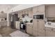 Kitchen features stainless steel appliances, white subway tile backsplash, and neutral-toned cabinetry at 15806 N 45Th Pl, Phoenix, AZ 85032