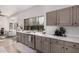 Bright kitchen featuring a large window, plenty of counter space, and stainless steel appliances at 15806 N 45Th Pl, Phoenix, AZ 85032