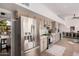 Bright kitchen with stainless steel appliances, tile backsplash, and wood-look floors at 15806 N 45Th Pl, Phoenix, AZ 85032