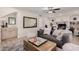 Cozy living room with a wet bar, fireplace, and comfortable seating, creating a relaxing atmosphere at 15806 N 45Th Pl, Phoenix, AZ 85032