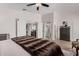 Bright and airy main bedroom showcasing a large mirror and stylish furnishings at 15806 N 45Th Pl, Phoenix, AZ 85032