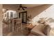 Covered patio with ceiling fan features dining table, cushioned sofa, and outdoor decor at 15806 N 45Th Pl, Phoenix, AZ 85032