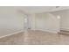 Bright living room with neutral walls, tile floors and an open and airy atmosphere at 17471 W Watson Ln, Surprise, AZ 85388