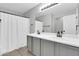 Bathroom features double sinks with white countertop and grey cabinets at 1858 S Ocotillo Dr, Apache Junction, AZ 85120