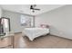 Well lit bedroom featuring light gray walls, tiled floors, and a ceiling fan at 1858 S Ocotillo Dr, Apache Junction, AZ 85120