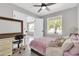 Comfortable bedroom with a ceiling fan, tiled floors, and neutral-colored walls at 1858 S Ocotillo Dr, Apache Junction, AZ 85120