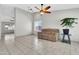 Bright living room with a large window, tiled floor, and comfortable seating, perfect for relaxation at 1858 S Ocotillo Dr, Apache Junction, AZ 85120