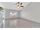 Spacious living room with tile flooring and natural light from the window at 1858 S Ocotillo Dr, Apache Junction, AZ 85120