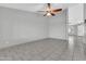 Minimalist living room with tiled floors and a view into adjacent rooms for an open feel at 1858 S Ocotillo Dr, Apache Junction, AZ 85120