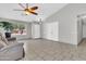 Spacious living room with vaulted ceiling, tiled floors, and large windows for natural light at 1858 S Ocotillo Dr, Apache Junction, AZ 85120