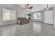 Well-lit living room with neutral paint, tiled flooring, and great natural light from the windows at 1858 S Ocotillo Dr, Apache Junction, AZ 85120