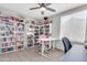Office with a ceiling fan, lots of bookshelves, and natural light at 1858 S Ocotillo Dr, Apache Junction, AZ 85120