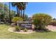 Papago Park Village II community signage landscaped with mature trees, green grass, and shrubbery at 1905 E University Dr # 139, Tempe, AZ 85288