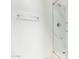 White marble-look shower with glass door and brushed metal fixtures at 1905 E University Dr # 139, Tempe, AZ 85288
