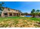 Spacious backyard offers a refreshing pool, desert landscaping, and ample space for relaxation and activities at 19415 W Colter St, Litchfield Park, AZ 85340