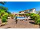Beautiful pool area is surrounded by lush landscaping, offering a private oasis for relaxation and enjoyment at 19415 W Colter St, Litchfield Park, AZ 85340