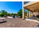 Inviting backyard oasis with a pool, patio, and lush landscaping at 19415 W Colter St, Litchfield Park, AZ 85340