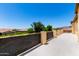The balcony view overlooks a neighborhood with serene landscaping and mountain views, for peace and tranquility at 19415 W Colter St, Litchfield Park, AZ 85340