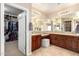 Spacious bathroom with granite counters, dual sinks, and walk-in closet with ample storage space at 19415 W Colter St, Litchfield Park, AZ 85340