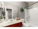 Bathroom featuring a vanity, a shower over the tub, and white fixtures at 19415 W Colter St, Litchfield Park, AZ 85340