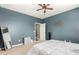 Minimalist bedroom with neutral-toned walls and bright natural lighting at 19415 W Colter St, Litchfield Park, AZ 85340