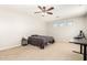 Bedroom with a ceiling fan, three windows, and a bed at 19415 W Colter St, Litchfield Park, AZ 85340