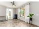 Versatile bonus room with lots of natural light and tile floors, suitable for an office or fitness area at 19415 W Colter St, Litchfield Park, AZ 85340