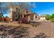 Stunning two-story home boasts stone accents and desert landscaping, creating an inviting curb appeal with southwest charm at 19415 W Colter St, Litchfield Park, AZ 85340