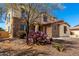 Stunning two-story home boasts stone accents and desert landscaping, creating an inviting curb appeal with southwest charm at 19415 W Colter St, Litchfield Park, AZ 85340