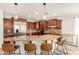 Open kitchen with stainless steel appliances, a large island, and pendant lighting at 19415 W Colter St, Litchfield Park, AZ 85340