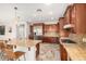 Gourmet kitchen featuring stainless appliances, granite countertops, and ample cabinet space at 19415 W Colter St, Litchfield Park, AZ 85340