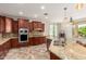 Spacious kitchen with a double sink, stainless steel appliances and granite countertops at 19415 W Colter St, Litchfield Park, AZ 85340