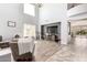 Bright living room with high ceilings, large windows, and neutral walls providing a modern, open feel at 19415 W Colter St, Litchfield Park, AZ 85340